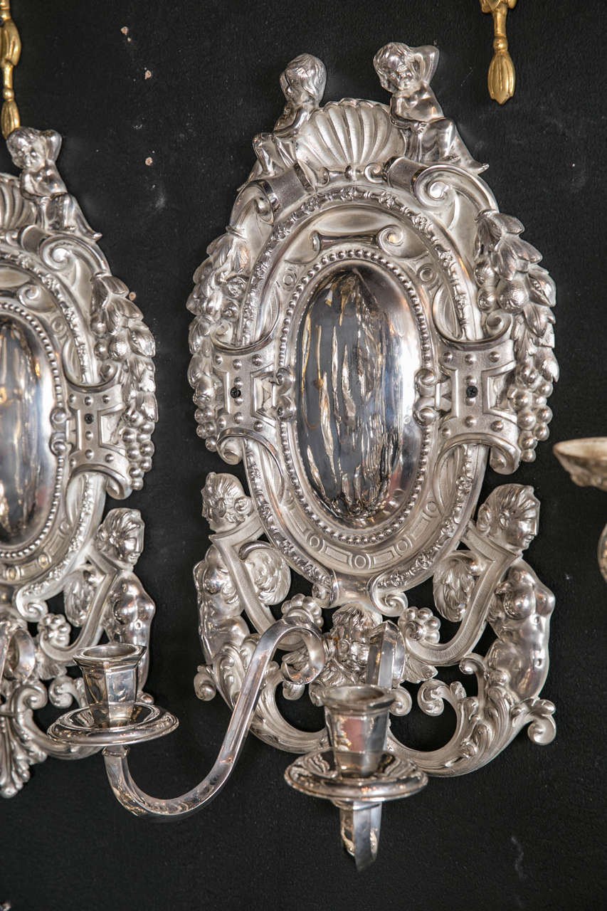 Pair of large circa 1920s silver plated Caldwell sconces.