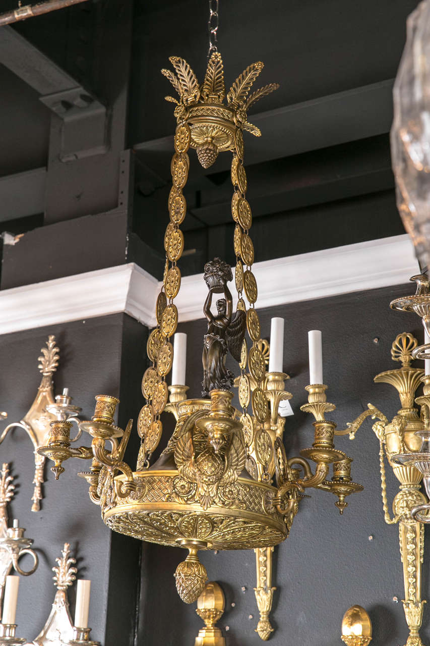 19th c. French empire chandelier, featuring swans on the body. Original finish.