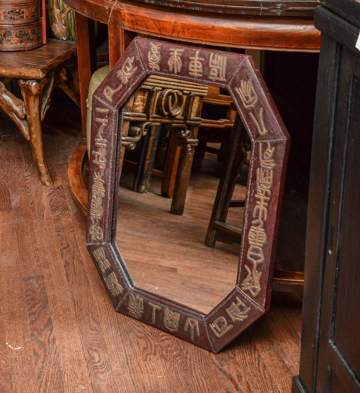 Turn of the Century Q'ing Dynaty Leather Wrapped and Golden Painted Octagonal Mirror