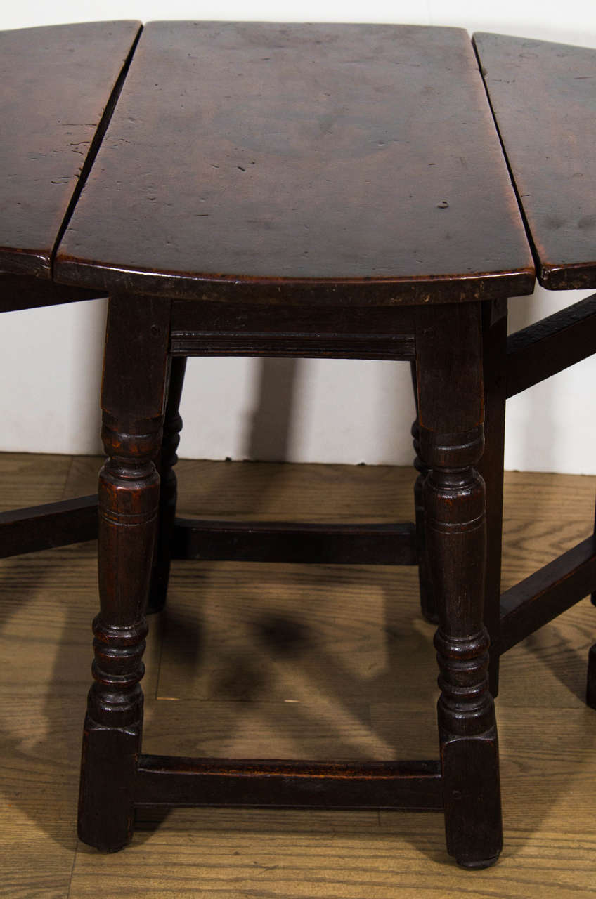 Renaissance An English Patinated Chestnut and Walnut Gate-leg Side Table For Sale