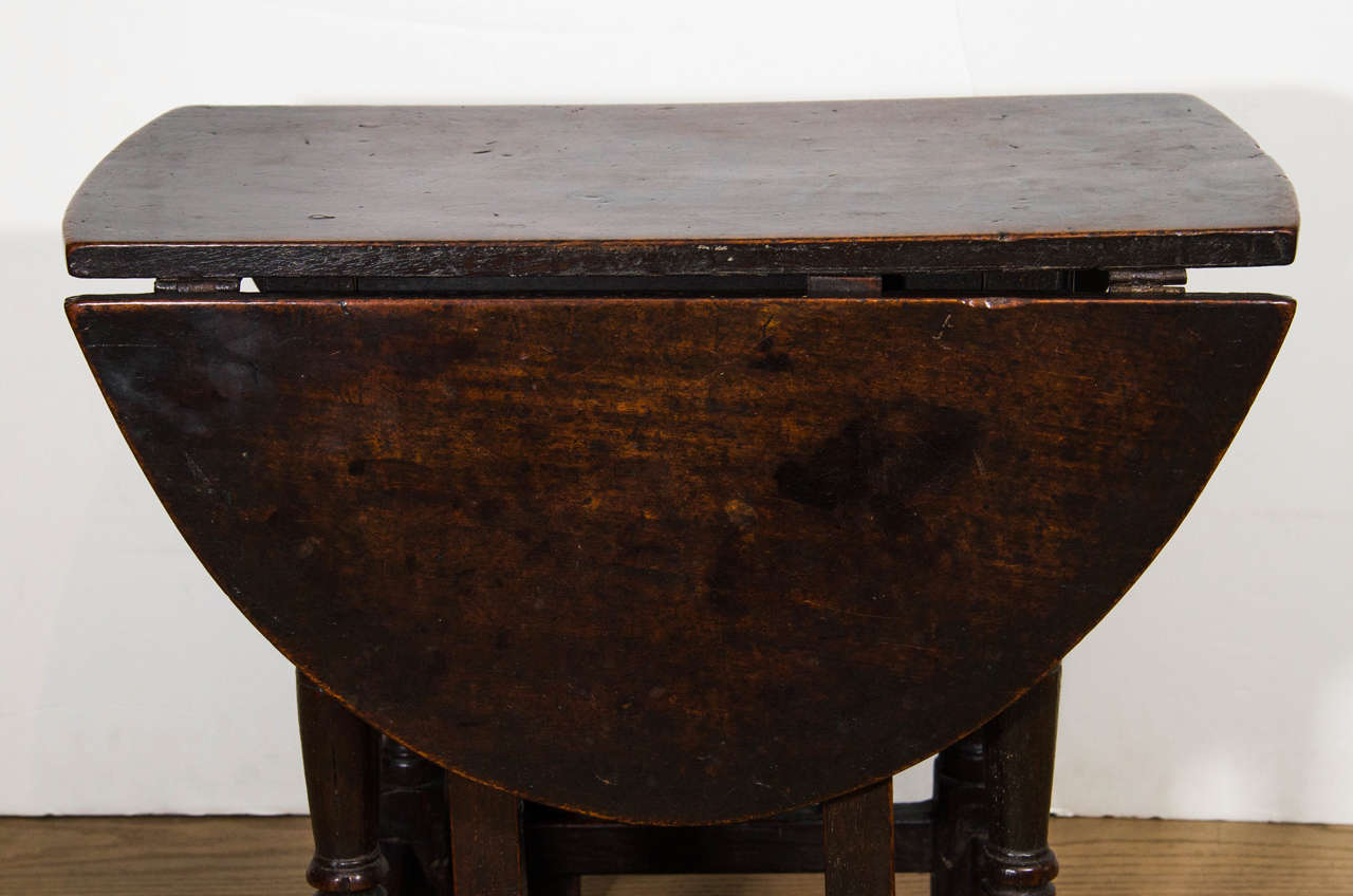 An English Patinated Chestnut and Walnut Gate-leg Side Table For Sale 4