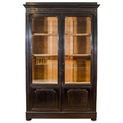 A French 19th century Ebony and Oak China Cabinet
