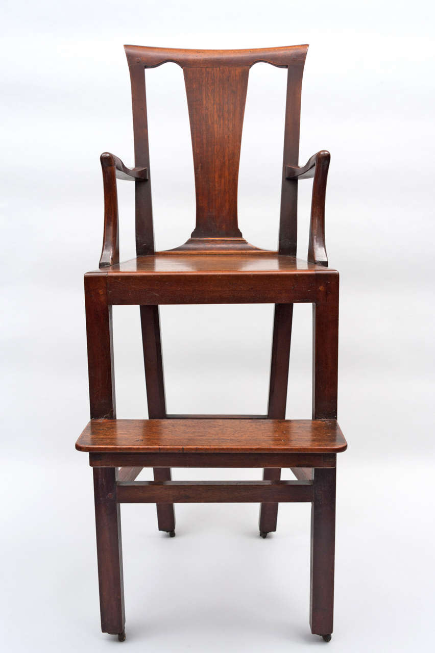 A rare Geo III mahogany child's high chair; the rectangular back with a tapering solid splat, with shaped arms above a solid seat, the square legs incorporating a foot rest and original leather castors.
£2,500