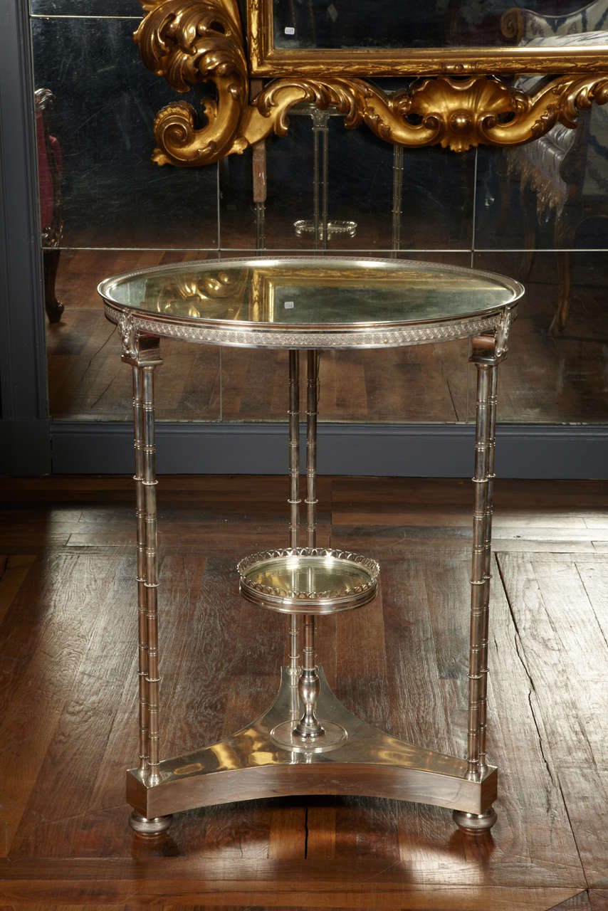 Pair of pedestals, tripod, double small columns, silver bronze and top eglomized mirror (white gold leaf).