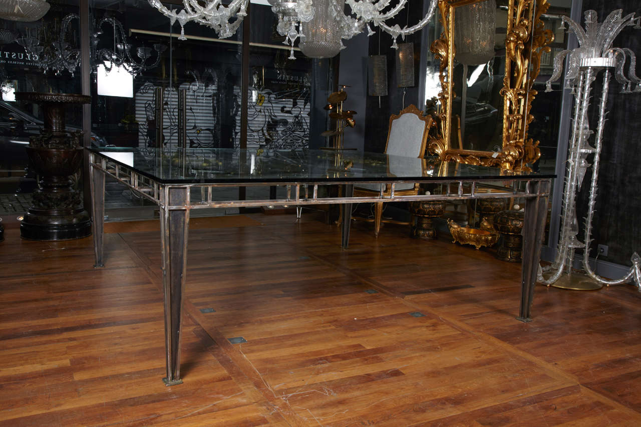 Dining room table, attributed to Poillerat, top with wrought iron panels and important glass of 19mm 