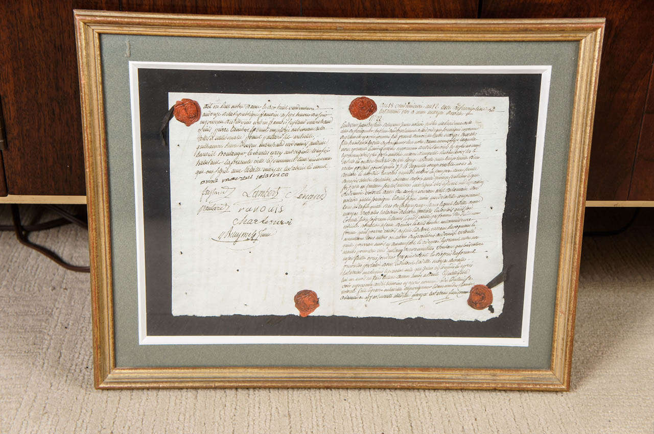 An 18th century framed document with wax seals from France. Stamped on the reverse with authenticity markings.