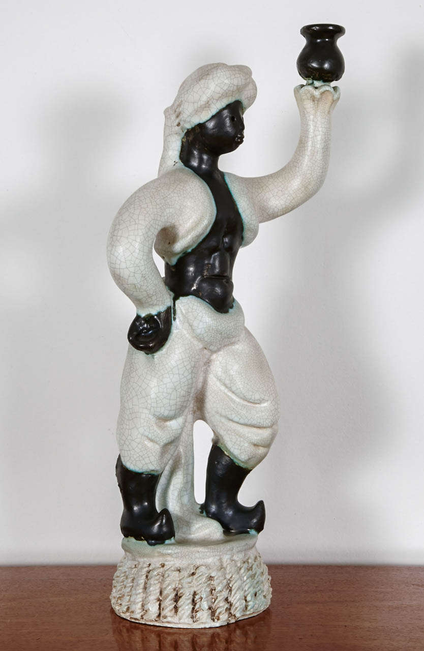 Georges Jouve (1910-1964) torchere. Large black and white crackled enameled ceramic candlestick. circa 1945. Signed with the alpha below base (Jouve mark). It can be equiped with a lamp socket instead of a candle.
Georges Jouve is one of the most