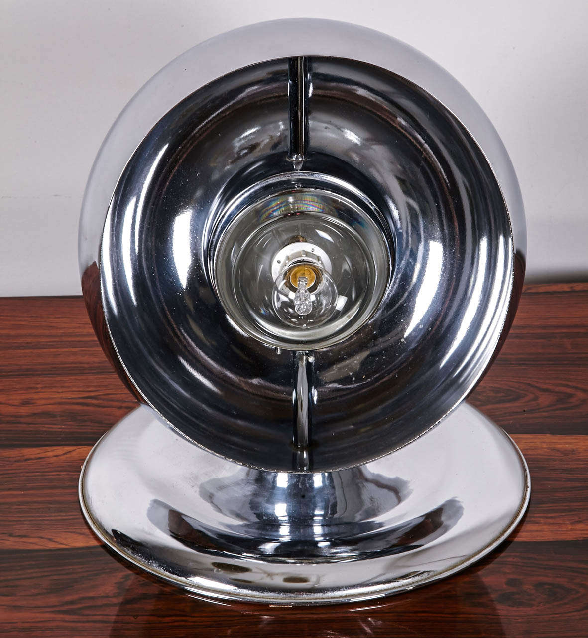 A globe chromed metal table lamp
The bulb is hidden behind the inner metal globe
Italy, 1970's
