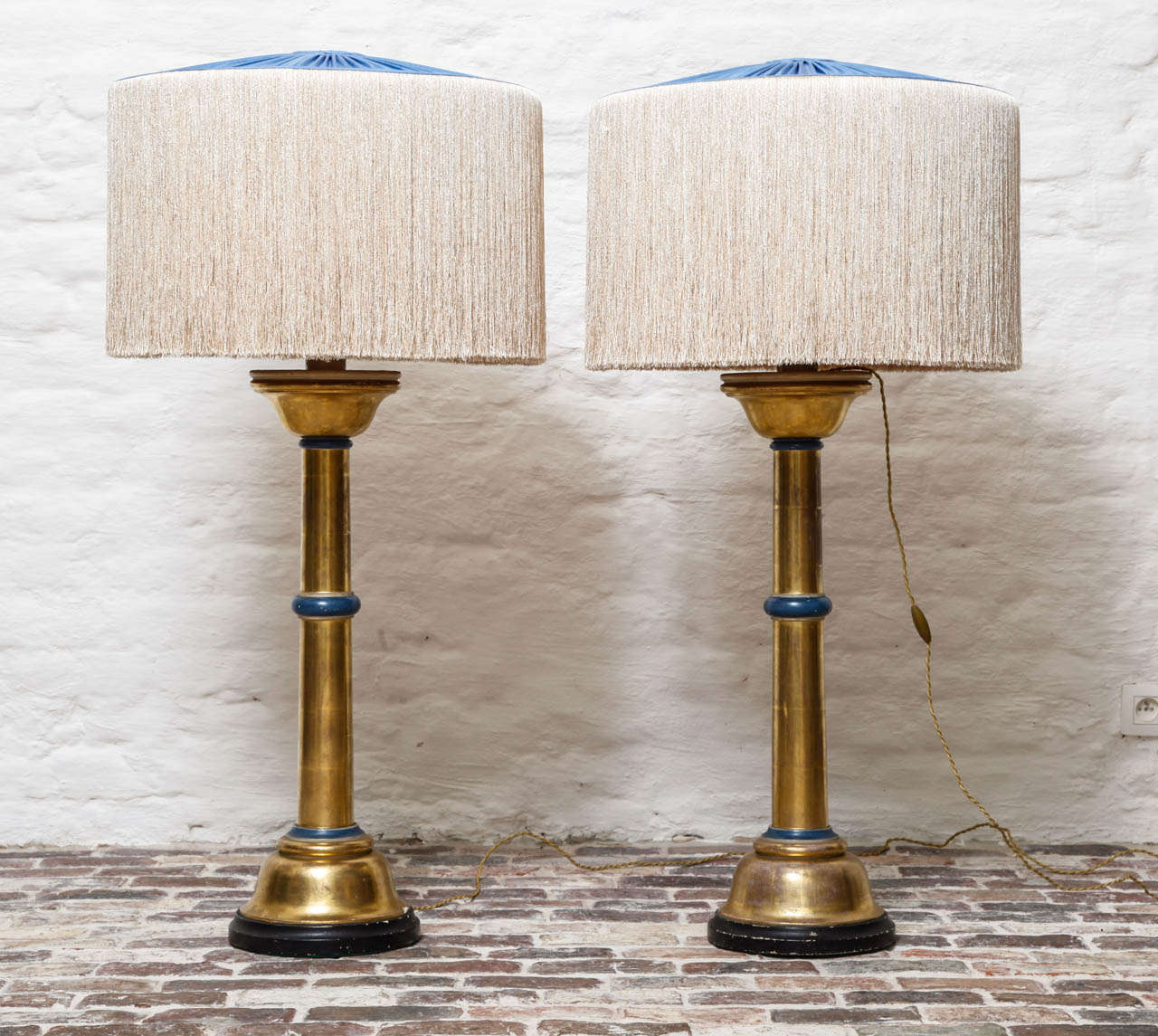 pair of gilt wood lamps, with blue painted details and blue silk shade with ivory tassels