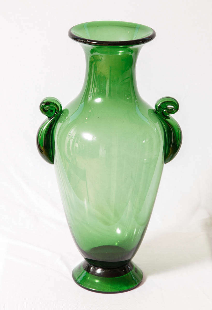 Tall glass vase executed by Vetrerie empolesi in Empoli, Italy.
Literature : ''Il vetro «verde» di Empoli. Le collezioni fiorentine (1930-1960)'', Edizioni Polistampa, Florence, 2002.