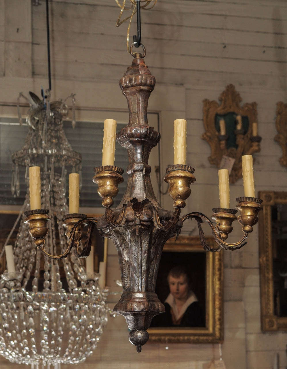 Italian chandelier, silvered and carved with leaf motif. Tole leaf under each of the 6 iron arms ending in gilt wood bobeches. US wired.