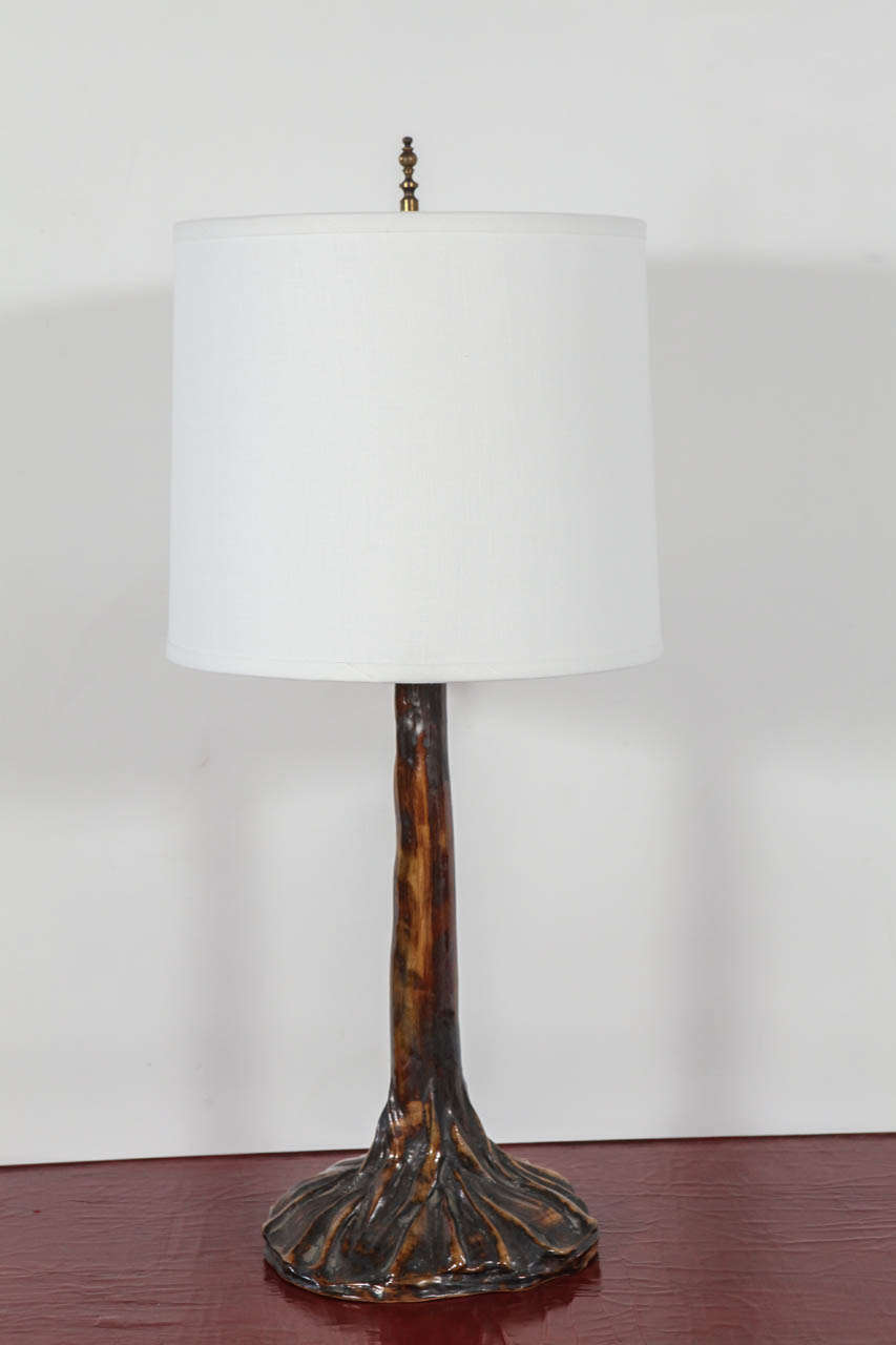 Glazed pottery tree trunk table lamp. Newly rewired with silk twist cord. Shade sold separately (approx. $100).

Height to top of socket measures 23