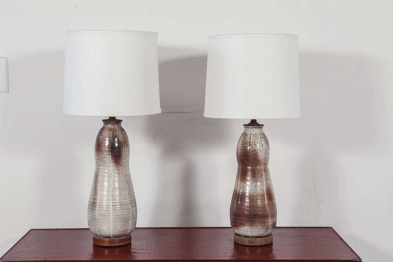 Gourd shaped table lamps in white and brown. Newly rewired with silk twist cord. Shades sold separately (approx. $75).

Height to top of socket measures 20