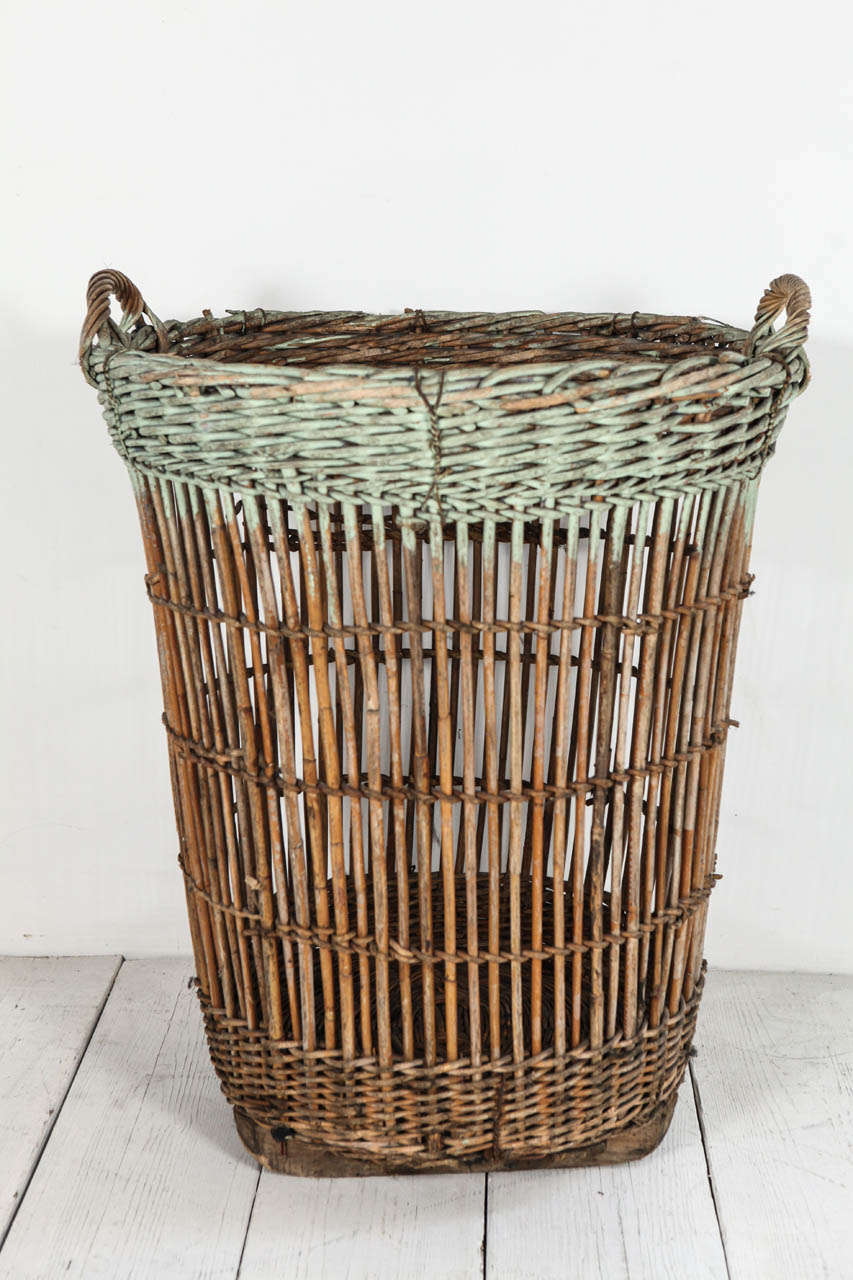 Large round basket with green patina.
