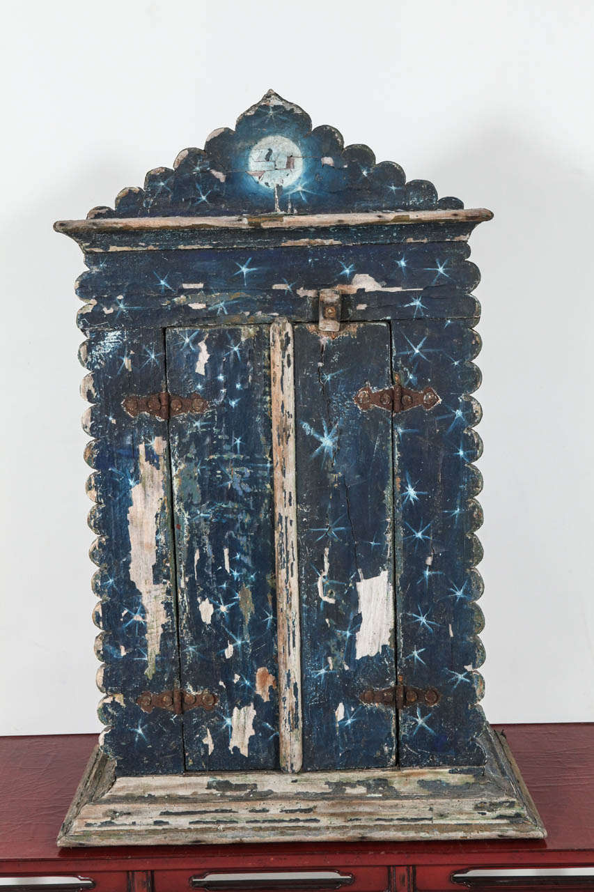 Moon and star motif painted shrine with strong patina.