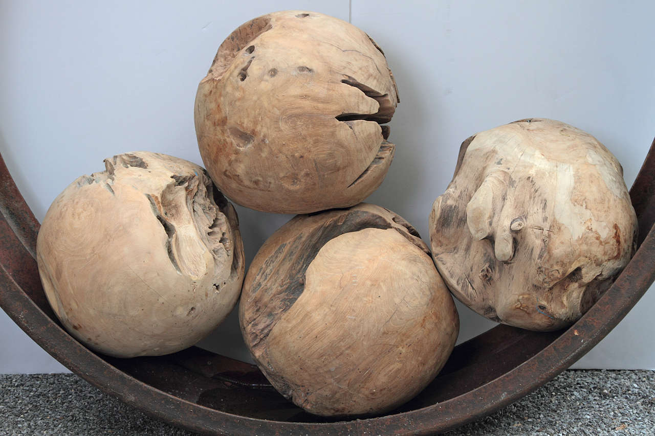 Antique Wood Balls made of hundred year old teak tree roots
Will give you a strong natural look for home decor or garden accessory 
 Teak Balls for Indoor & Outdoor use
The Teak Balls can be cut flat to make Teak Ball Seats and Teak Ball