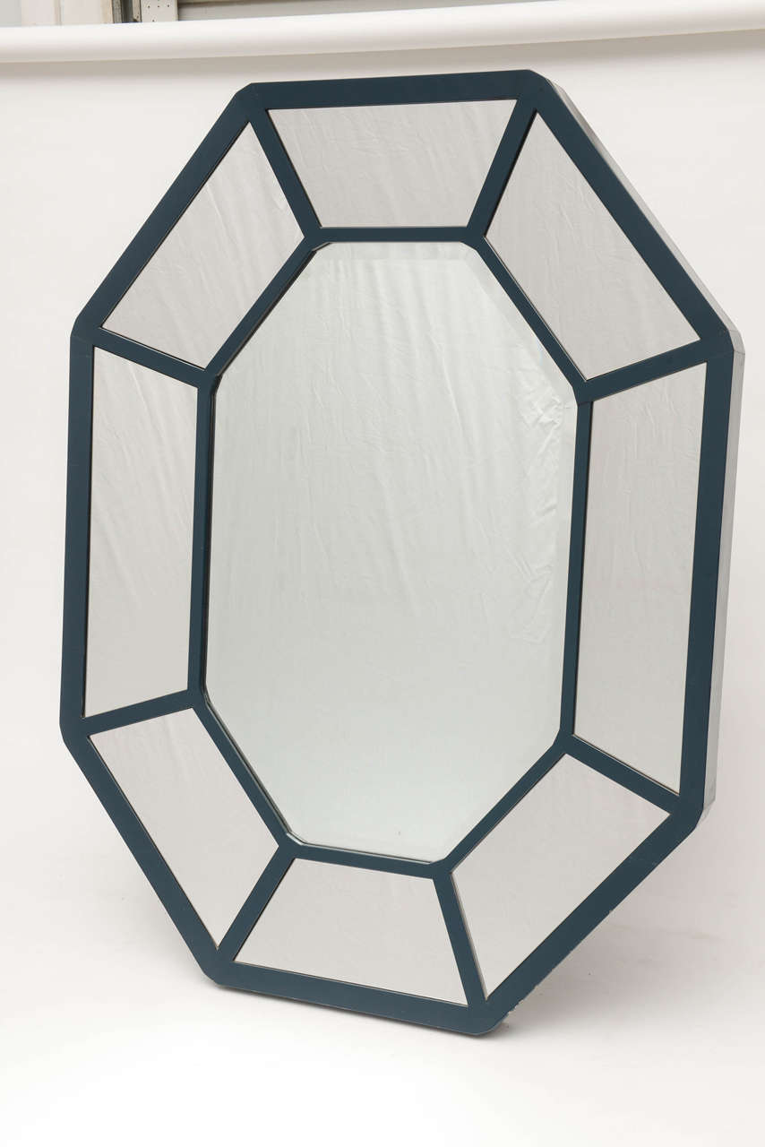 This is one of our favorite Karl Springer mirrors.
Wood trim is dark blue.