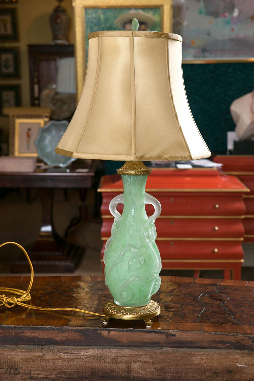 A green with frosted overlay, Steuben glass vase now a lamp with bronze mounts.