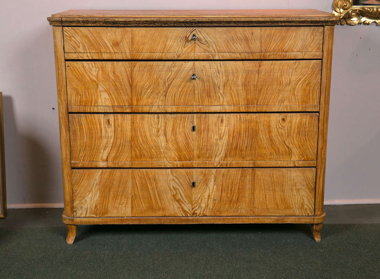 A mid-19th century Scandinavian faux wood-grained, four-drawer chest with four additional small drawers within the second drawer.