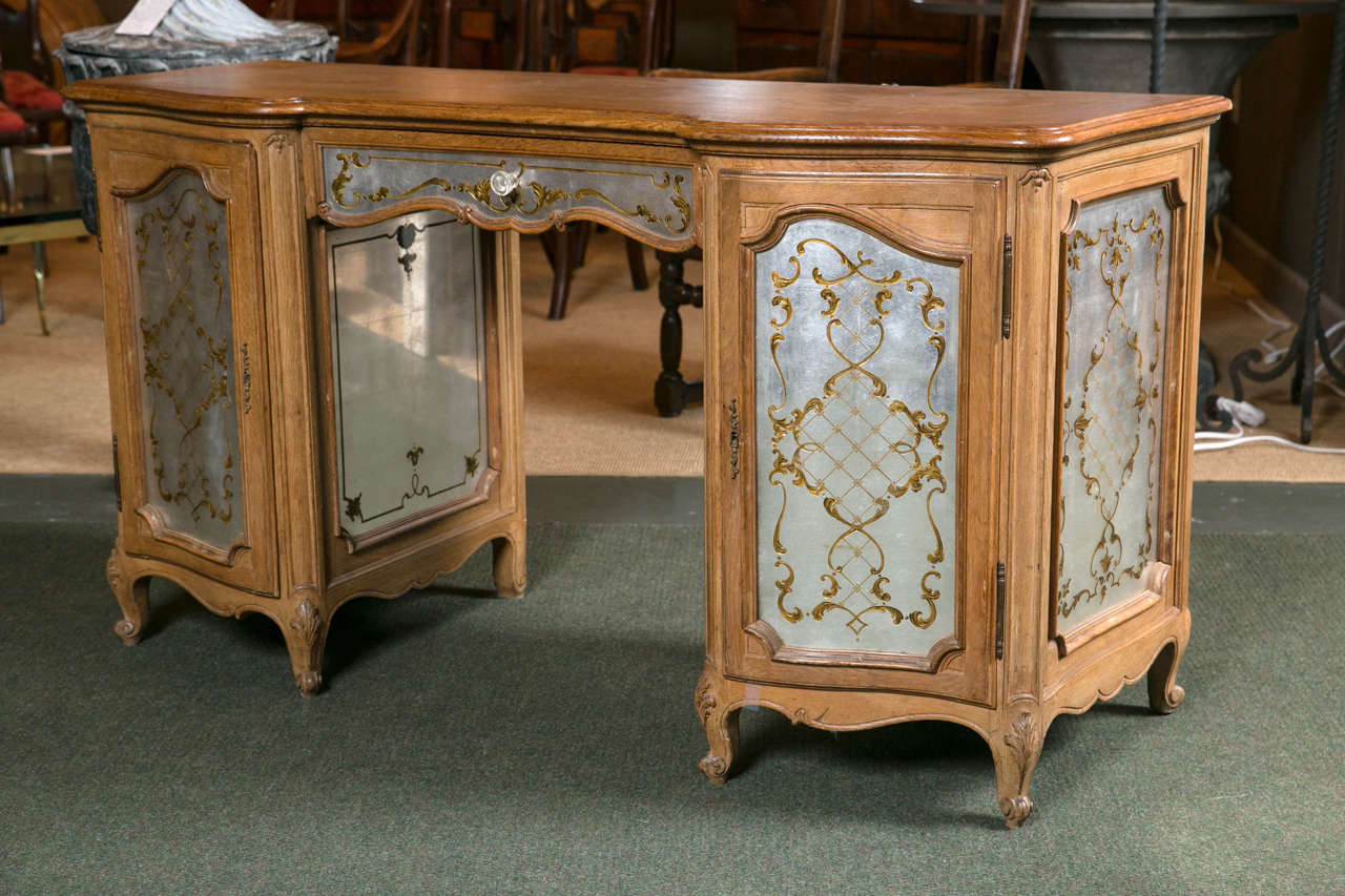A rare Louis XV style Jansen oak and Lucite desk.
