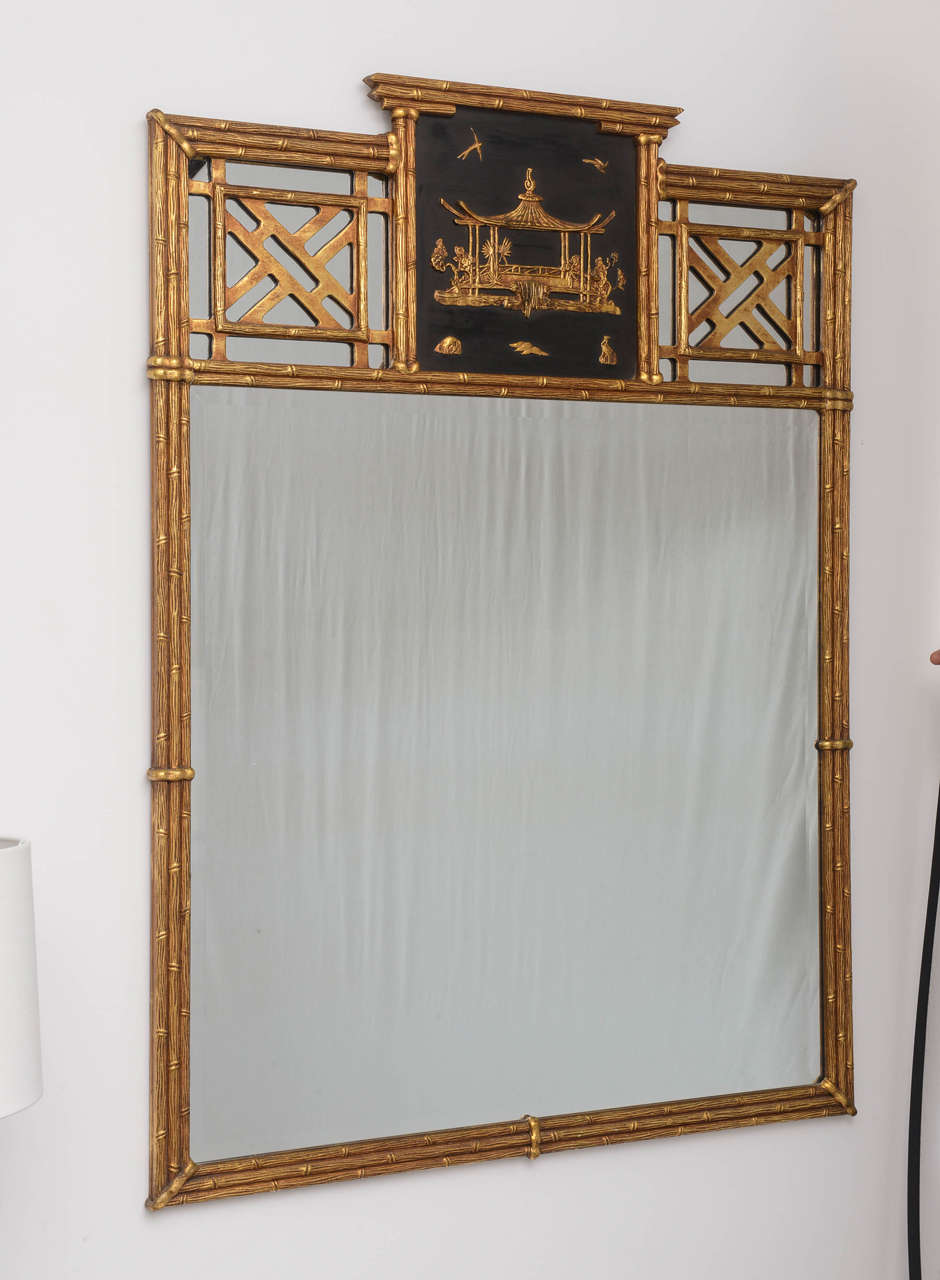 Exquisite Mid-Century chinoiserie mirror in the style of Chippendale. Wonderfully crafted, gold leaf over gesso and wood.