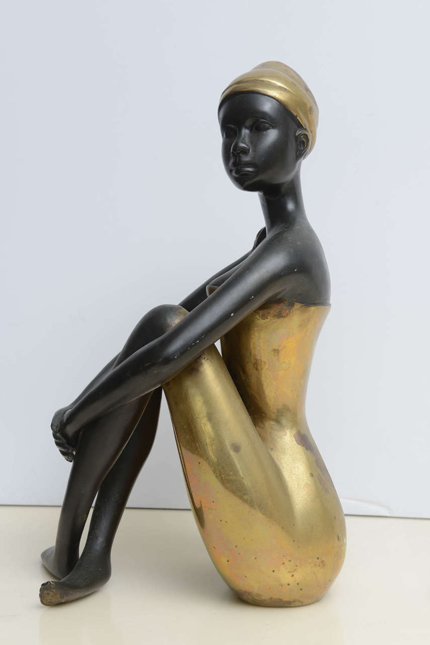Stunning sculpture of a lady done in bronze.  Partial Label on the underside bearing the letter H.