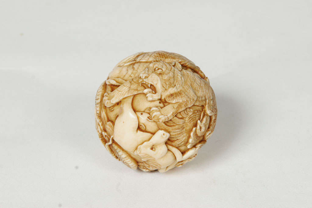 A 19th century Japanese Ivory spherical Okimono. 6