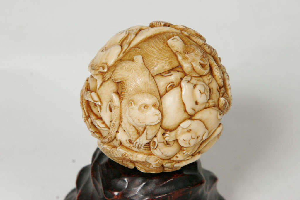 A 19th century Japanese Ivory spherical Okimono. 3