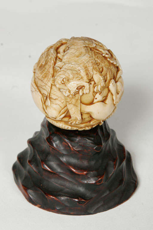 A 19th century Japanese Ivory spherical Okimono. 4