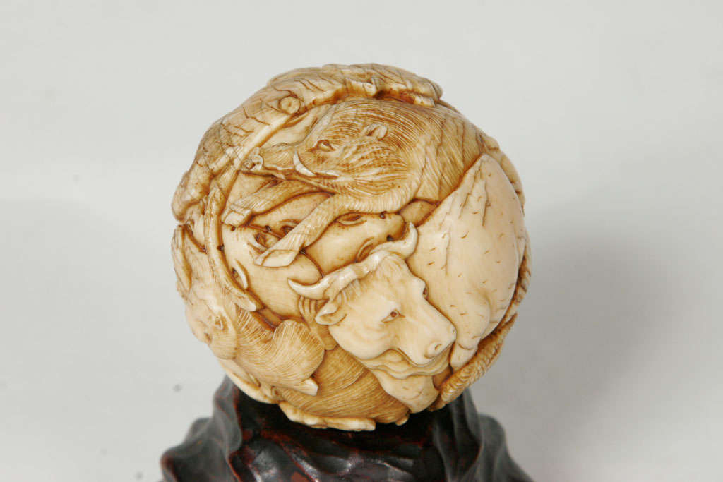 A 19th century Japanese Ivory spherical Okimono. 5