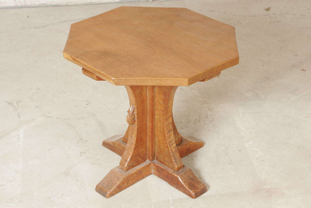 An Oak Robert "Mouseman" Thompson octagonal side Table, on cruciform pedestal with platform feet.
Adzed top.
Carved mouse.
Circa 1970
England
51 cm diameter x 46 cm high