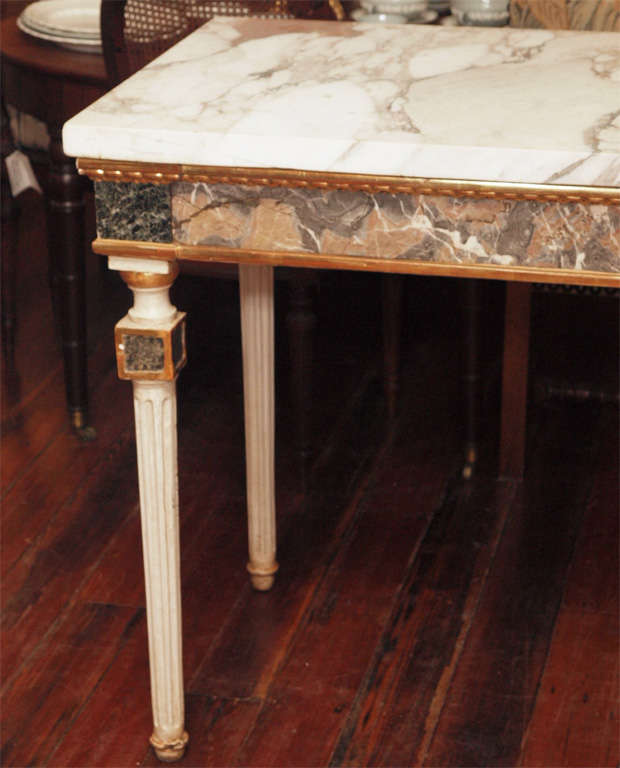 Pair of Marble inlaid, marble topped console tables. These are period Louis XV Italian.