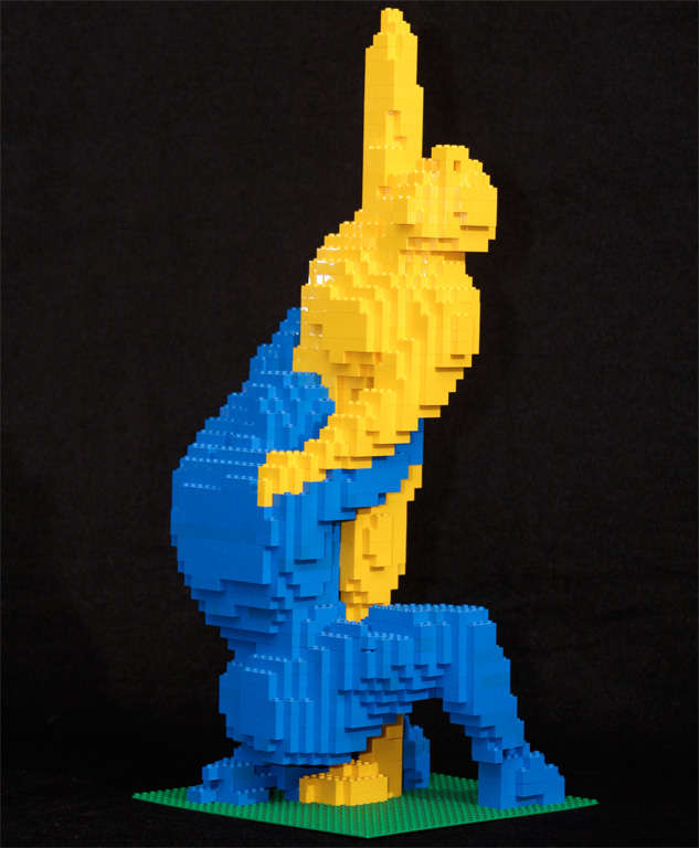 I gave this unsigned piece its title;  seemed fitting though they might be cheering or dancing.  This is constructed entirely from yellow and blue Legos.  What a fun conversation piece.