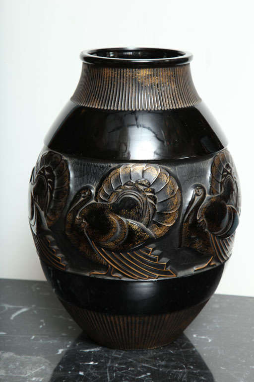Marius Ernest Sabino
Rare and Important Art Deco Vase, 1920’s
Black glass and gold enameled, decorated with stylized turkey on the middle row. Height: 14