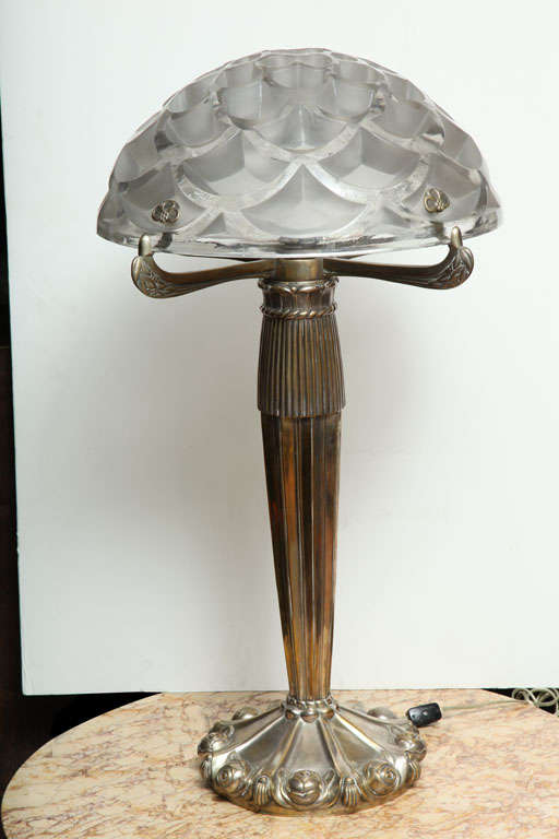 French Art Deco table lamp with a modern, silvered bronze base surmounted by a Rene Lalique “Rinceaux” glass shade created 1926 
28” High x 16.5“ Diameter