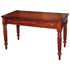 Antique English mahogany leather top writing table
