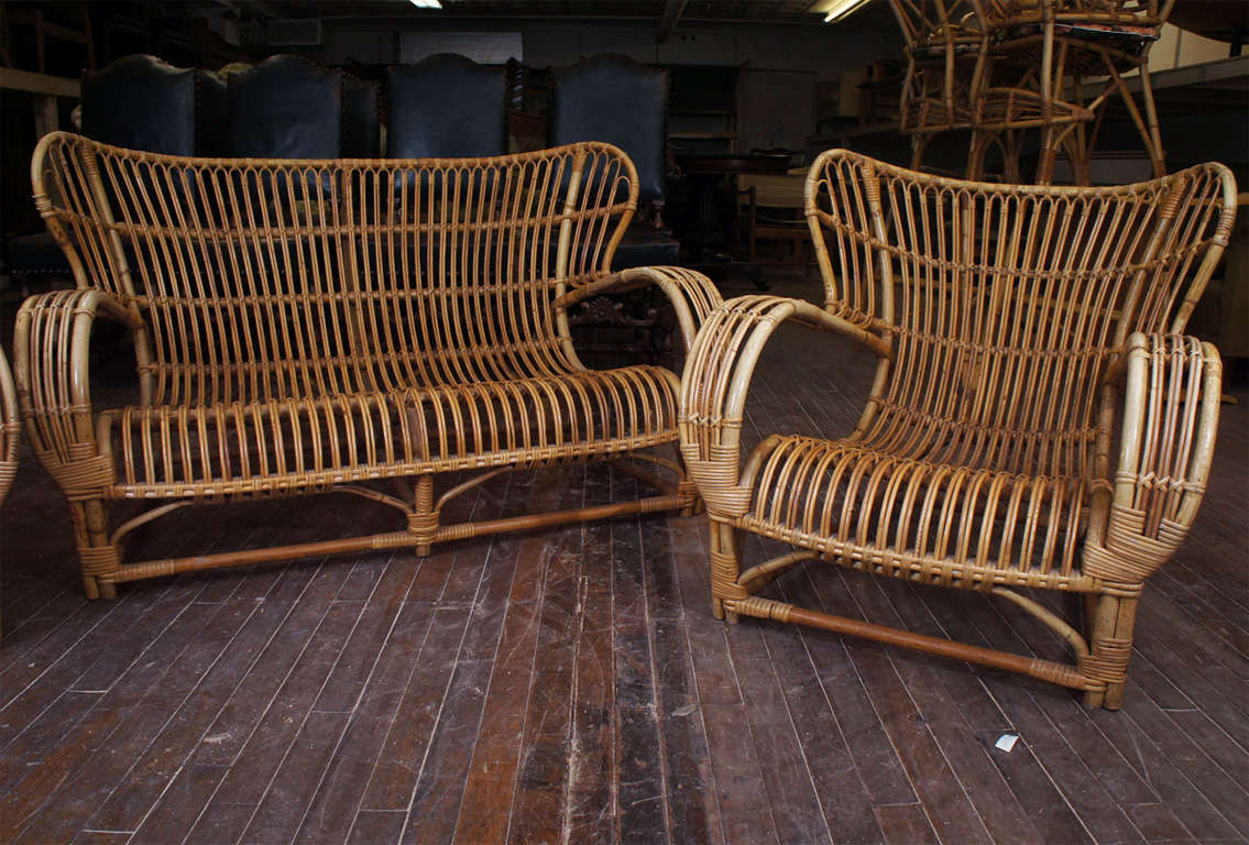 Three piece bamboo set by Danish designer Viggo Boesen for R. Wengler.  Good sturdy frames with great form from 1940's  including overstuffed cushions in original chintz fabric