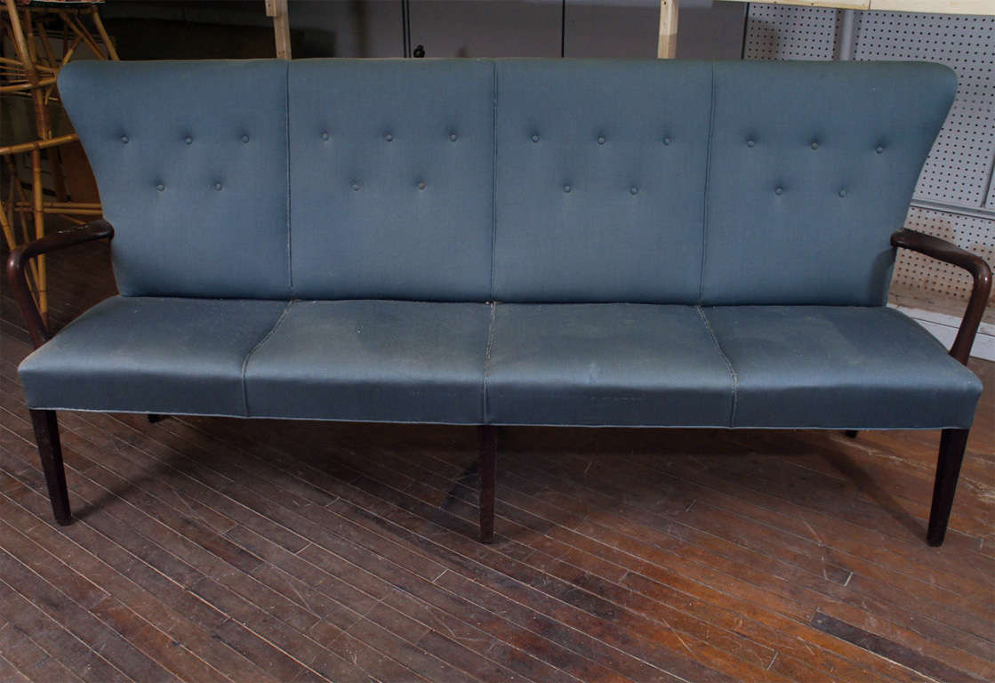 Classic modern bench, Ole Wanscher style, with mahogany frame, upholstered in blue fabric  with buttoned back, probably needing re-upholstery as back is unfinished.