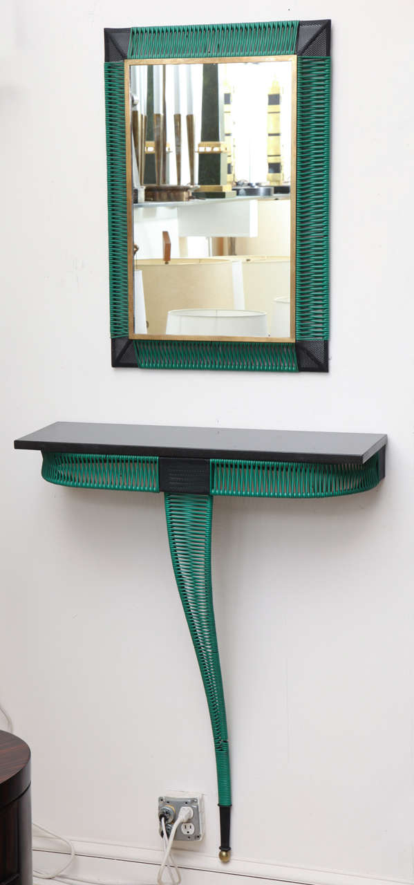 A 1950s French modernist console and mirror.
