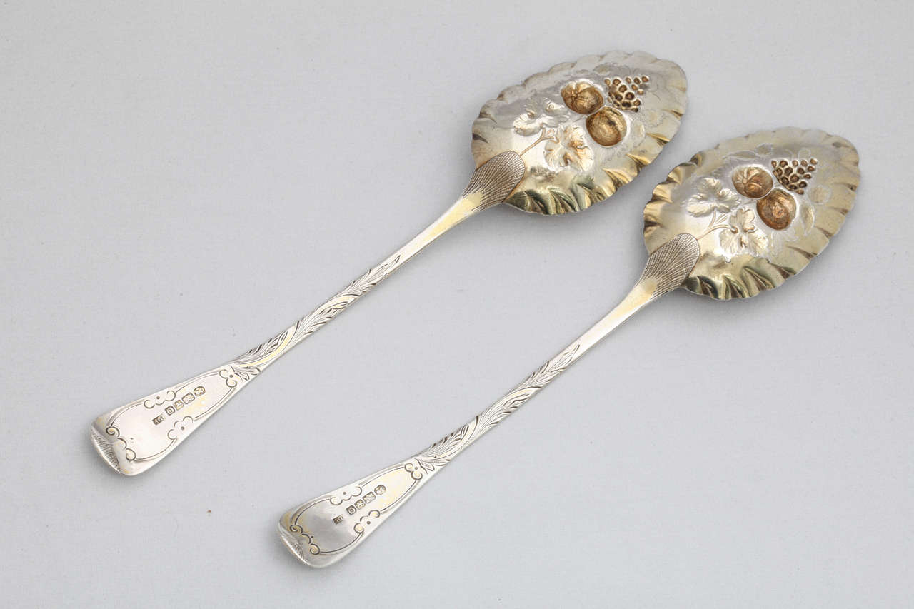 Rare pair of Georgian, sterling silver, parcel-gilt berry spoons, Exeter, England, 1830, William Woodman - maker. Measures: 9