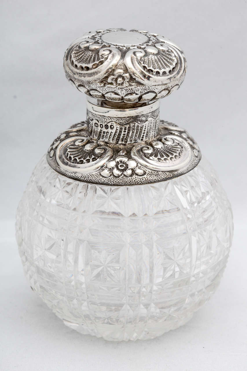Beautiful, sterling silver-mounted, cut crystal perfume bottle, London, 1889, sterling silver is beautifully decorated with a shell motif. Vacant Cartouche. Over 4 3/4