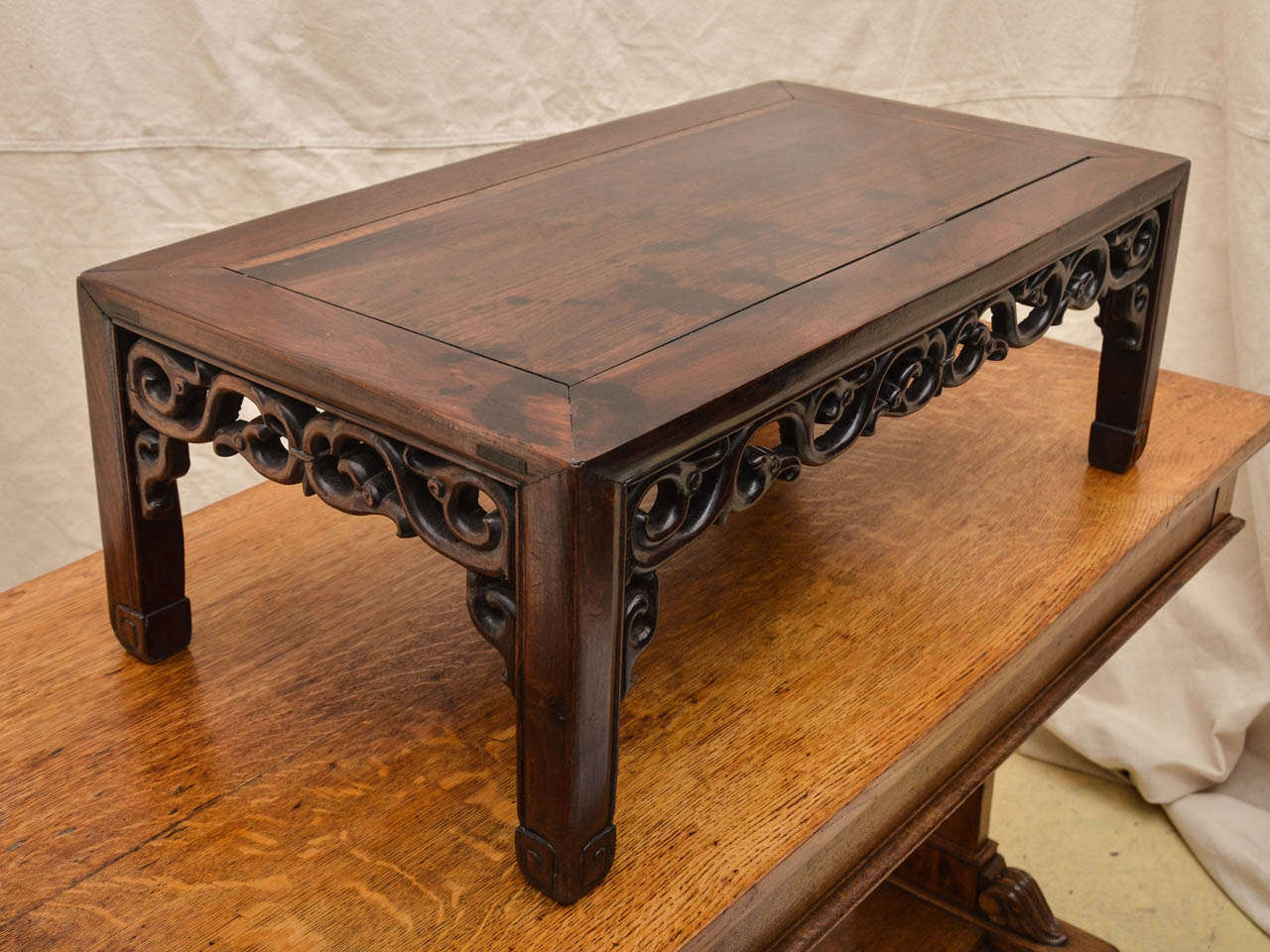 19th Cent. Chinese Low Opium Table With Scrolling Cut Out Apron. The Top Formed With A Mitered Joint -- Legs Terminating With A Carved Incised Greek Key Motif. The Table Has Beautiful Aged Patina. The Wood Is A Asian Hardwood  Similar To Rosewood.