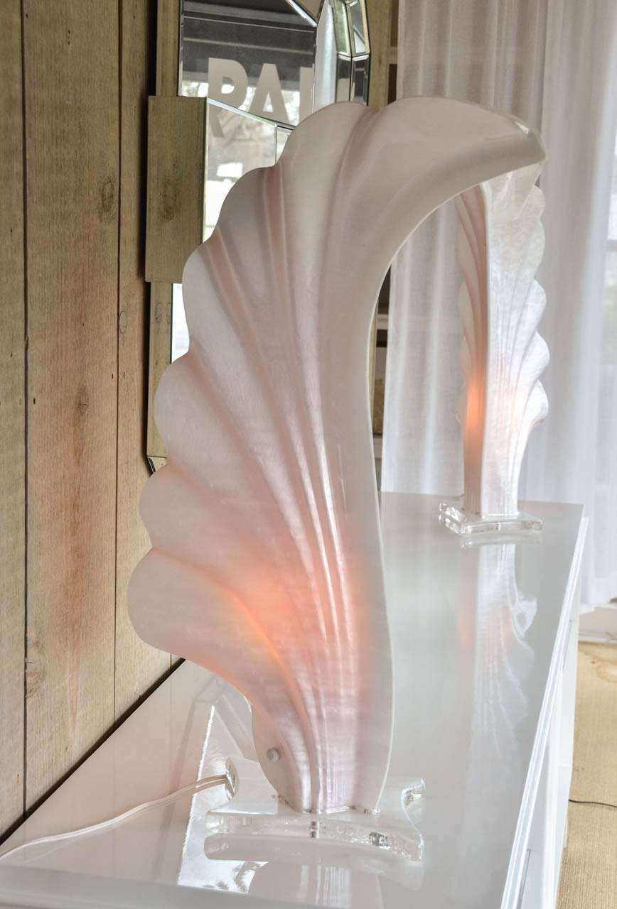 Fabulous and rare pair of acrylic shell shaped lamps by Rougier (Canada). The lamps are on acrylic bases.