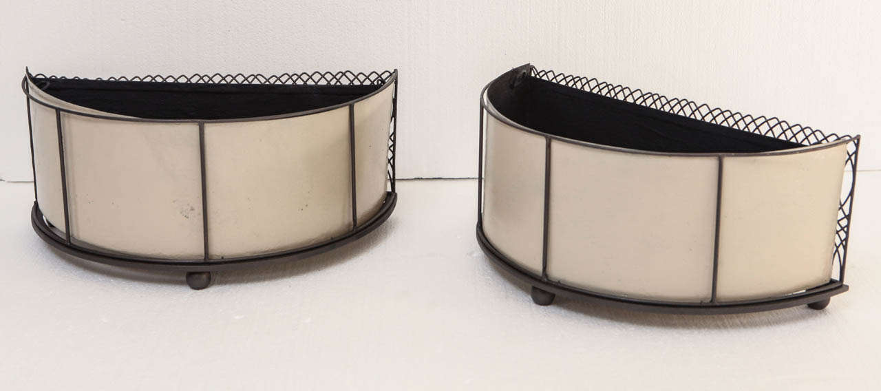 Circa 1940's painted semicircular plant holders for a tabletop. Brass wire frames with dark 
