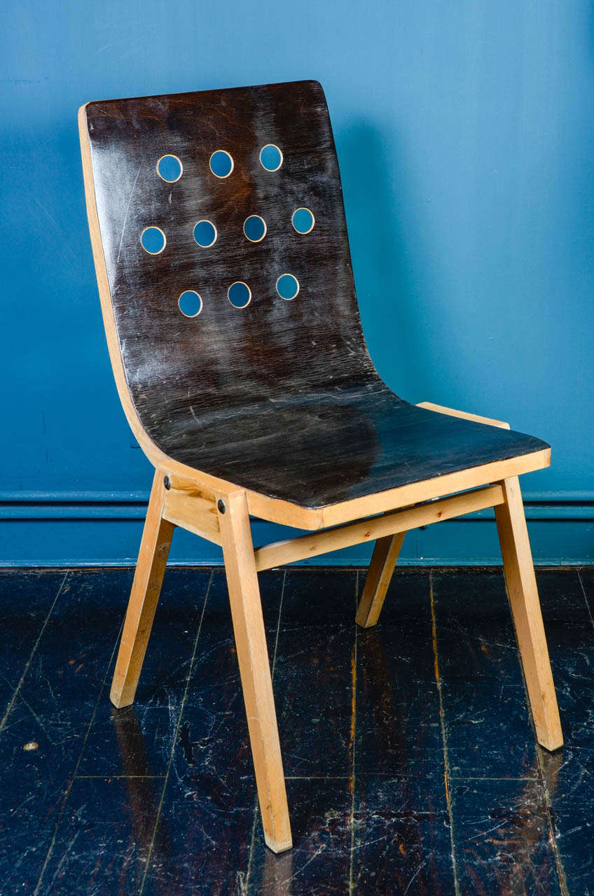 A rare set of eight Austrian stacking chairs. 
1950s by Roland Rainer from the Vienna City Hall, executed by Emil & Alfred Pollak. 
Plywood and beechwood.
Rare original patina.
Seat height: 46cm.