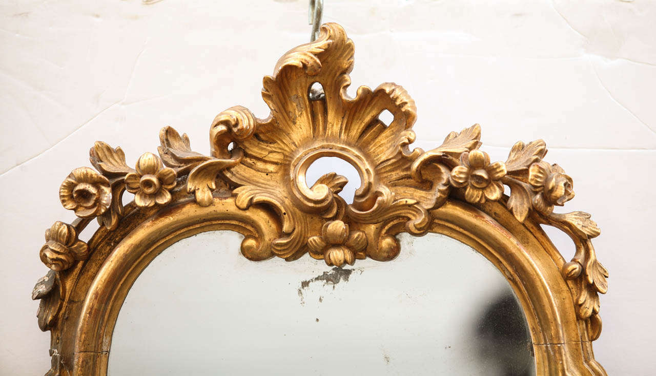 Une belle série de Quatre romains du 18' siècle   miroirs en bois doré  avec  trois chandeliers,

cm 95x45