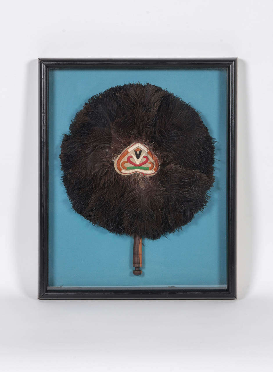 African tribal ceremonial fan of ostrich feathers with a Macassar handle mounted in a 1930s shadow-box frame. Fan in very good condition, original black paint on frame shows some wear.

This item can be seen at our showroom, 1stDibs@NYDC, 200