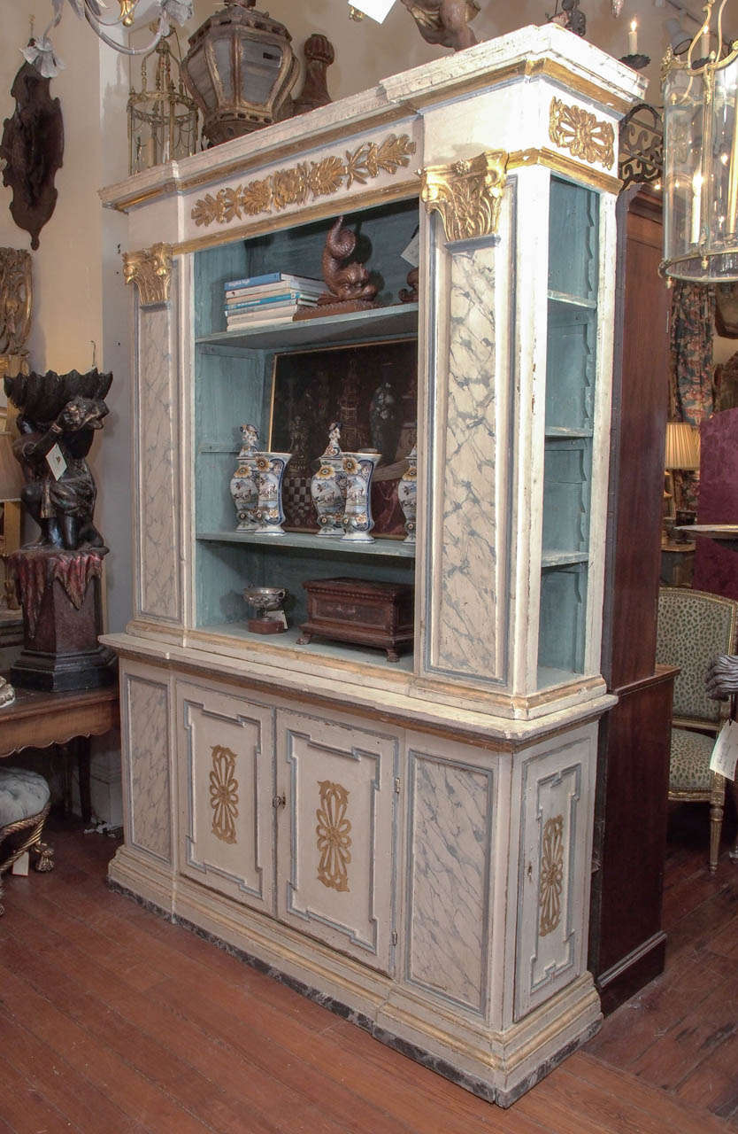 Italian 18th century painted, faux marble and gilt open bookcase with side shelves and cabinets beneath and on each side.