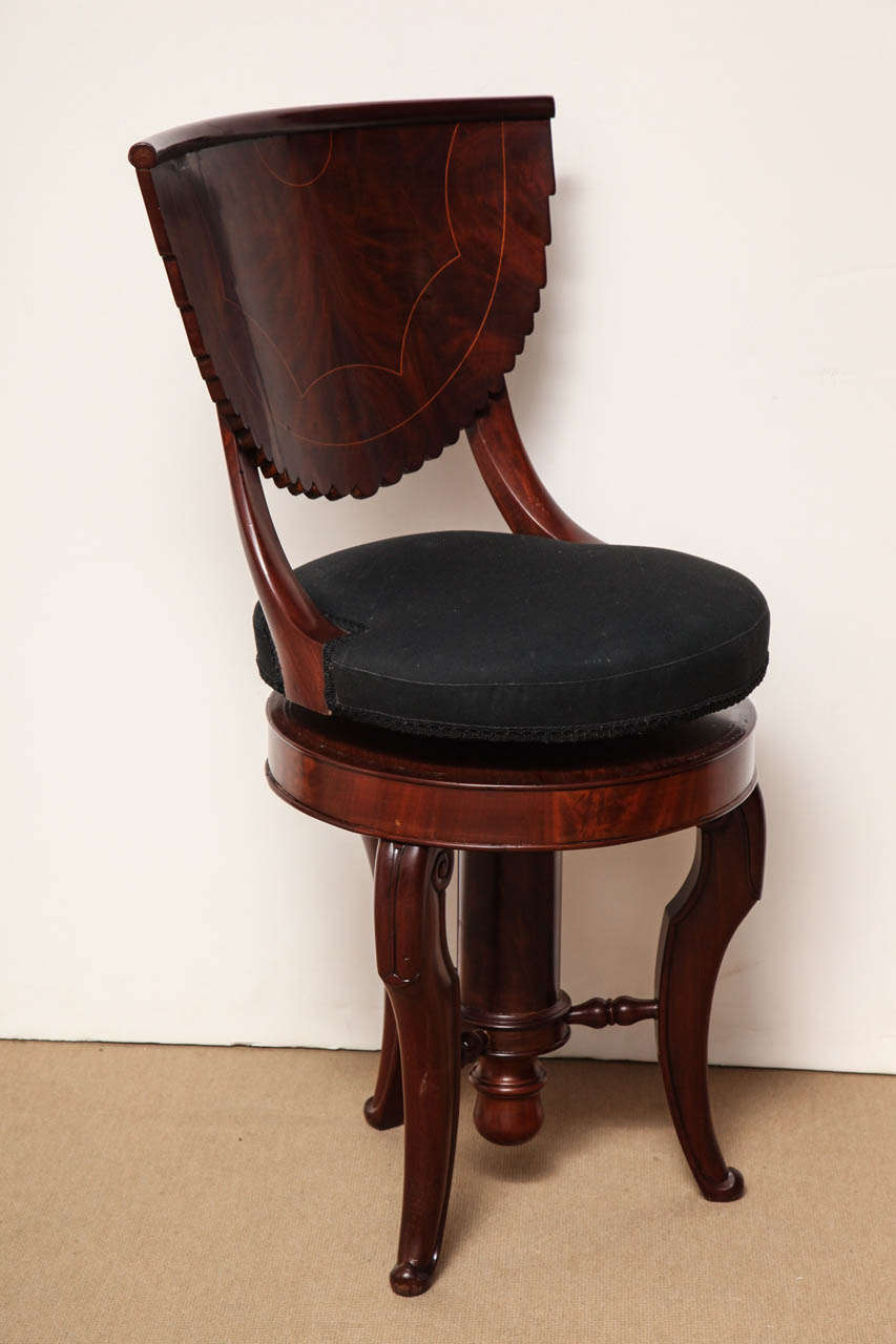 Early 19th Century French mahogany adjustable-height piano chair.