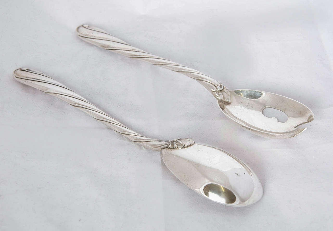 A Pair of Sterling Silver Salad Servers made by Buccelatti of Italy. The pattern is Torchon and the length of each piece is 25cms.